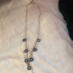 Coach necklace with original pouch.